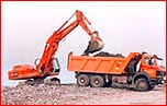 Retroexcavadora de oruga y camión Dumper 